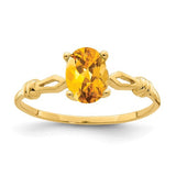14k gold oval citrine ring with 7x5mm gemstone, elegant jewelry ring by Solomon Jewelers.