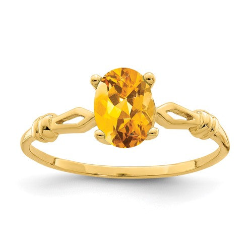14k gold oval citrine ring with 7x5mm gemstone, elegant jewelry ring by Solomon Jewelers.