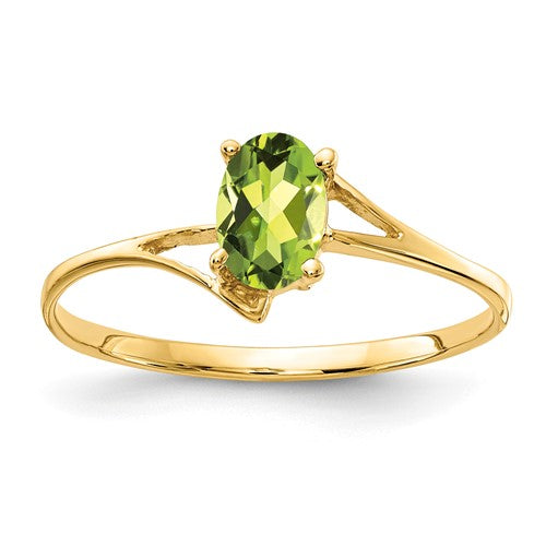 14k gold oval peridot ring with 6x4mm gemstone, elegant jewelry piece featuring a vibrant green peridot stone.