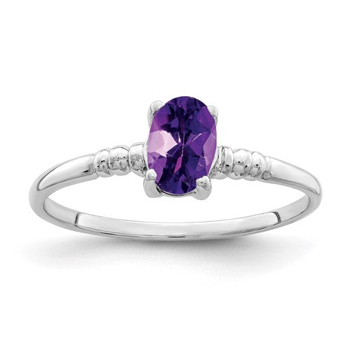 14k white gold oval amethyst ring with a 6x4mm gemstone, elegant jewelry piece featuring a polished band and vibrant purple stone.