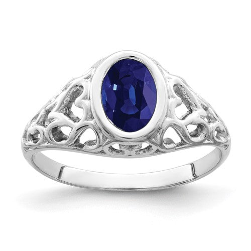 14k white gold oval sapphire ring with 7x5mm gemstone, elegant jewelry piece featuring a classic design.