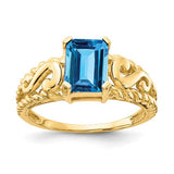 14k gold ring featuring an 8x6mm emerald cut blue topaz gemstone, elegant jewelry piece with Solomon Jewelers branding.