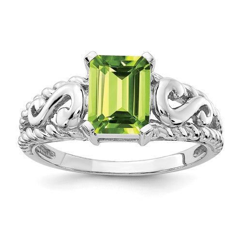 14k white gold emerald cut peridot ring with 8x6mm gemstone, featuring a sleek Solomon Jewelers design.