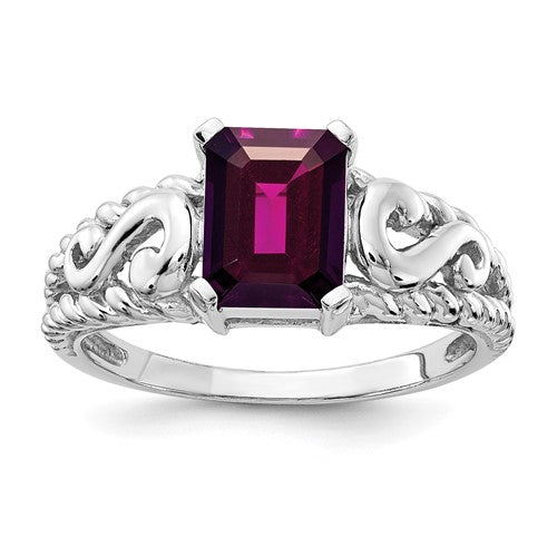 14k white gold ring with an 8x6mm emerald cut rhodolite garnet, showcasing a elegant jewelry design.