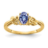 14k gold Tanzanite and diamond oval ring with 6x4mm stones, elegant jewelry piece from Solomon Jewelers