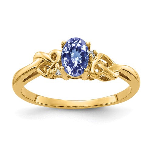 14k gold Tanzanite and diamond oval ring with 6x4mm stones, elegant jewelry piece from Solomon Jewelers