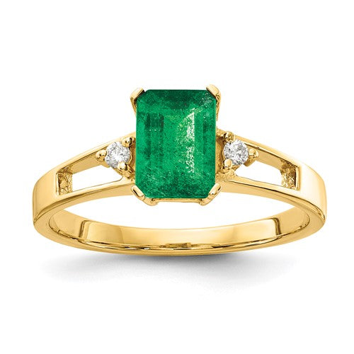 14k gold emerald cut emerald and AA diamond ring featuring a 7x5mm gemstone, designed by Solomon Jewelers.