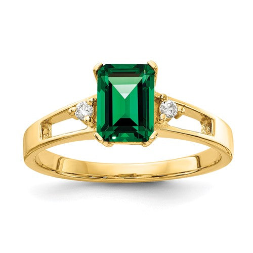14k gold ring with a 7x5mm emerald cut Mount St. Helens AA diamond, showcasing elegant jewelry design.