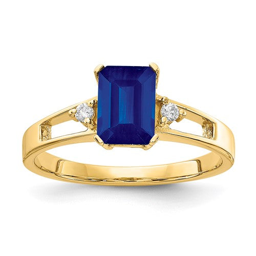 14k gold sapphire and diamond ring with 7x5mm emerald cut sapphire and AA quality diamonds, elegant jewelry piece.