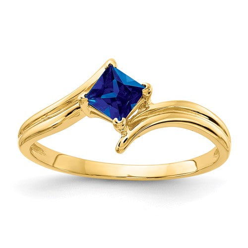 14k gold princess cut sapphire ring with a 4mm center stone, featuring elegant jewelry design from Solomon Jewelers.