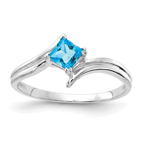 14k white gold princess cut blue topaz ring with a 4mm gemstone, elegant jewelry piece from Solomon Jewelers.