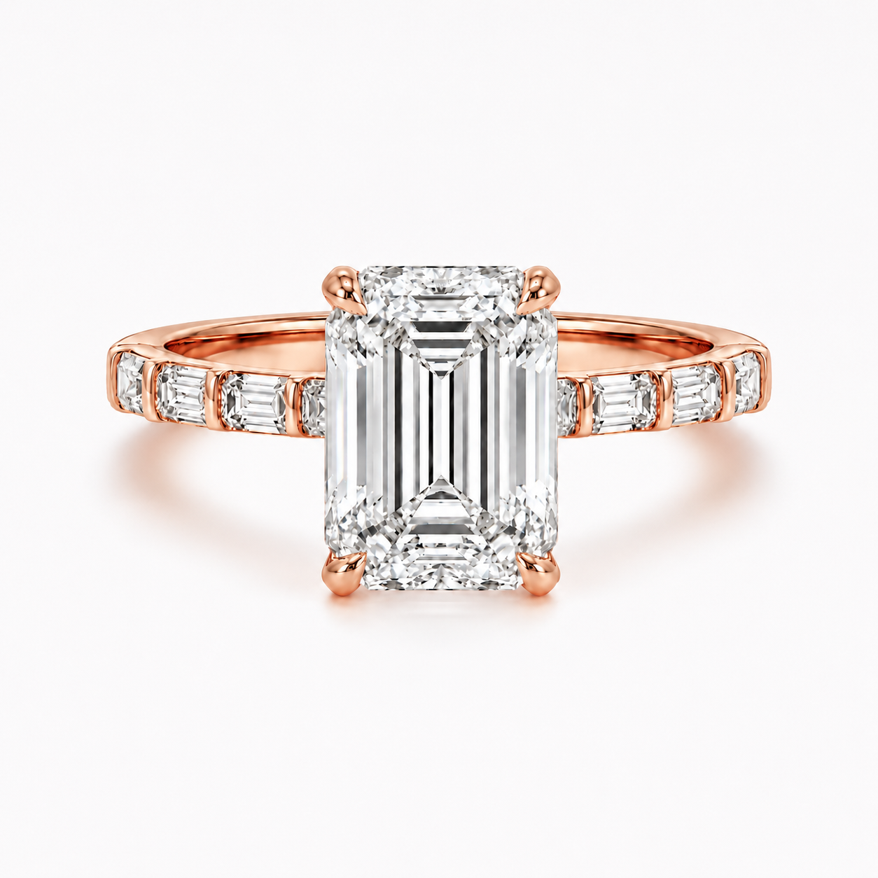 14k gold diamond engagement ring with a baguette diamond band and emerald-cut lab-grown diamonds, Solomon Jewelers.