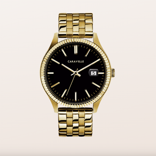 A luxury men's watch by Caravelle, featuring a gold-tone metal link bracelet, a fluted bezel, and a black dial with gold-tone indices and hands.