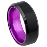 Black tungsten carbide ring with purple interior on a white background