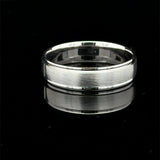 Brushed white gold men’s wedding band with polished raised edges available at Solomon Jewelers.