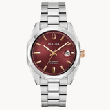 The rich burgundy dial has a sunburst finish and features rose gold-tone accents.