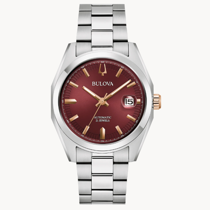 The rich burgundy dial has a sunburst finish and features rose gold-tone accents.