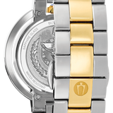 Close-up of the back of a two-tone stainless steel and gold link watch bracelet, showing the polished metal case and engraved details.