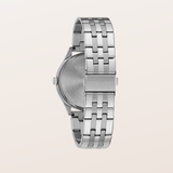 Silver stainless steel watch band with a multi-link design, shown from the back with the brushed metal case visible, on a light beige background.
