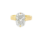 5 Carats yellow gold cushion cut solitaire diamond ring with hidden halo on cigar band.