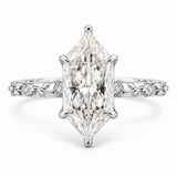 An engagement ring featuring a large rectangular baguette-cut center diamond in a four-prong setting on a silver-toned band adorned with small pavé diamonds and delicate floral motifs.