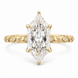 14K yellow gold ring featuring a Dutch marquise-cut lab-grown diamond in a six-prong setting with floral engraving and diamond accents on white.