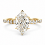 A yellow gold ring featuring a large marquise-cut diamond center stone and smaller diamonds set along the band, shown on a clean white background.