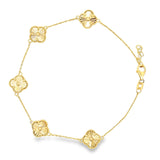 10K yellow gold clover style bracelet with a delicate floral motif and textured design, crafted by Solomon Jewelers.
