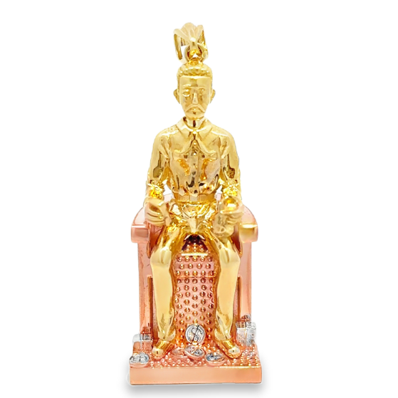 10 Karat gold Jesús Malverde pendant hanging from a chain, crafted by Solomon Jewelers, featuring detailed religious imagery.