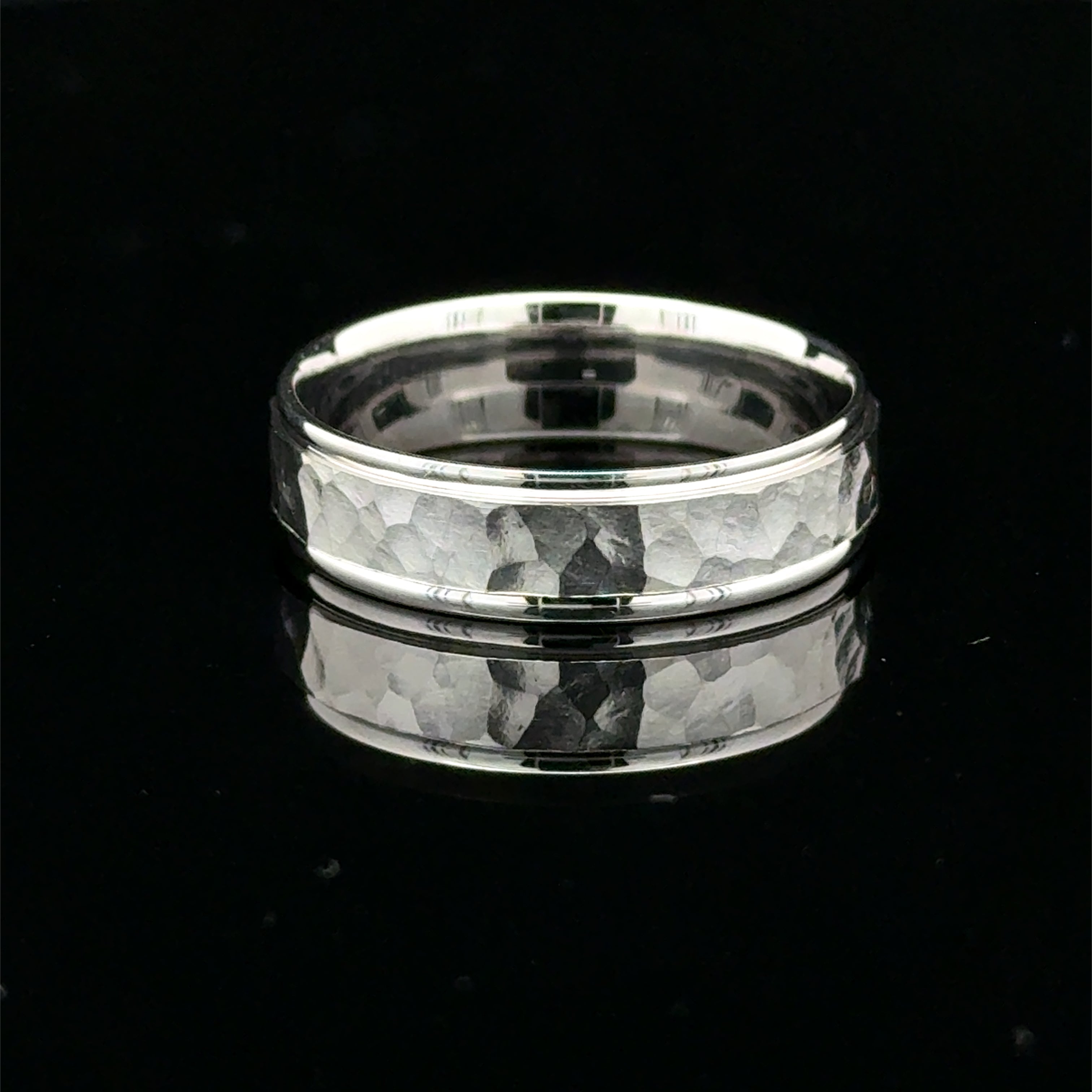 Hammered white gold men’s wedding band with polished raised edges available at Solomon Kansas.