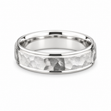 Hammered white gold men’s wedding band with polished raised edges.