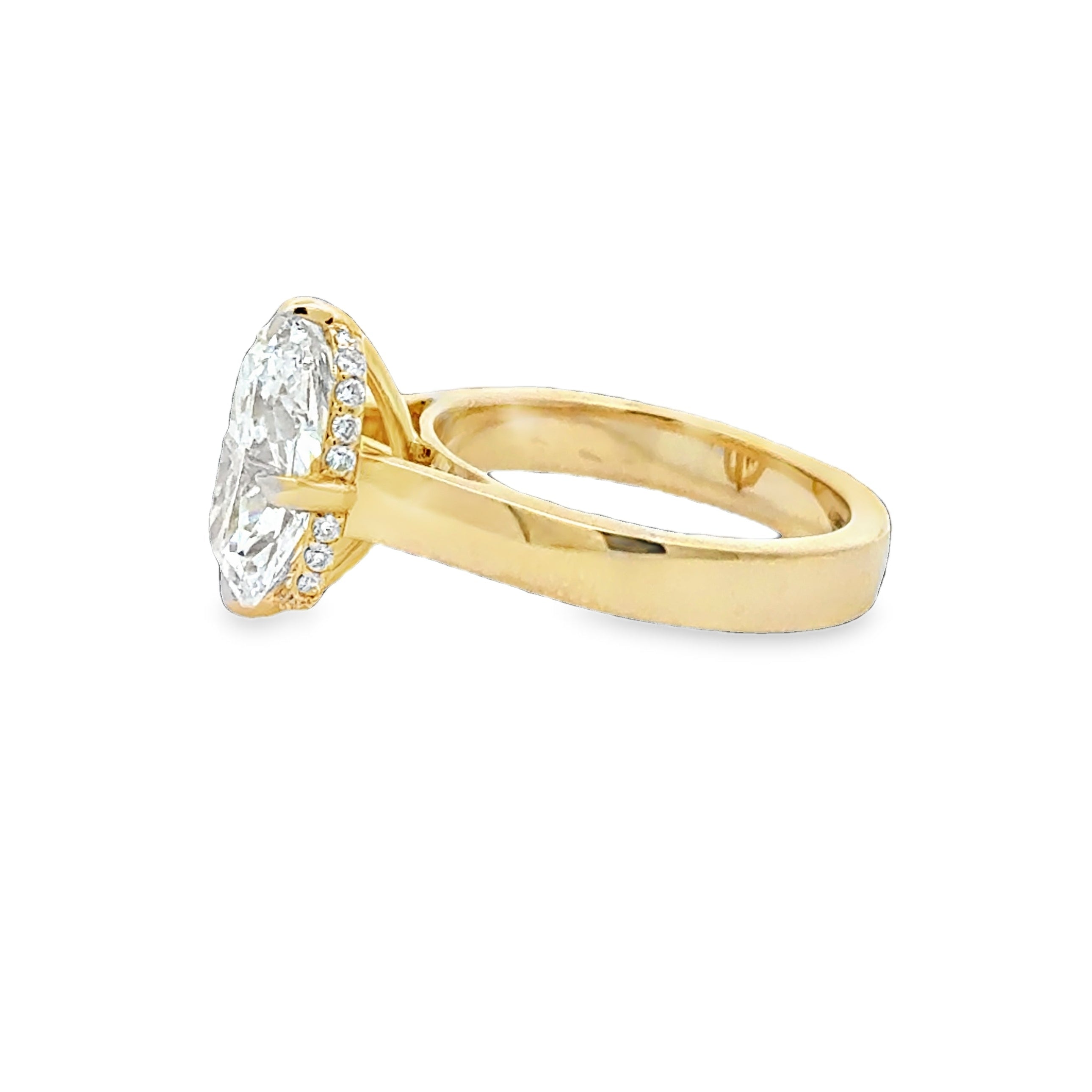 Cushion cut diamond engagement ring with cigar band side view