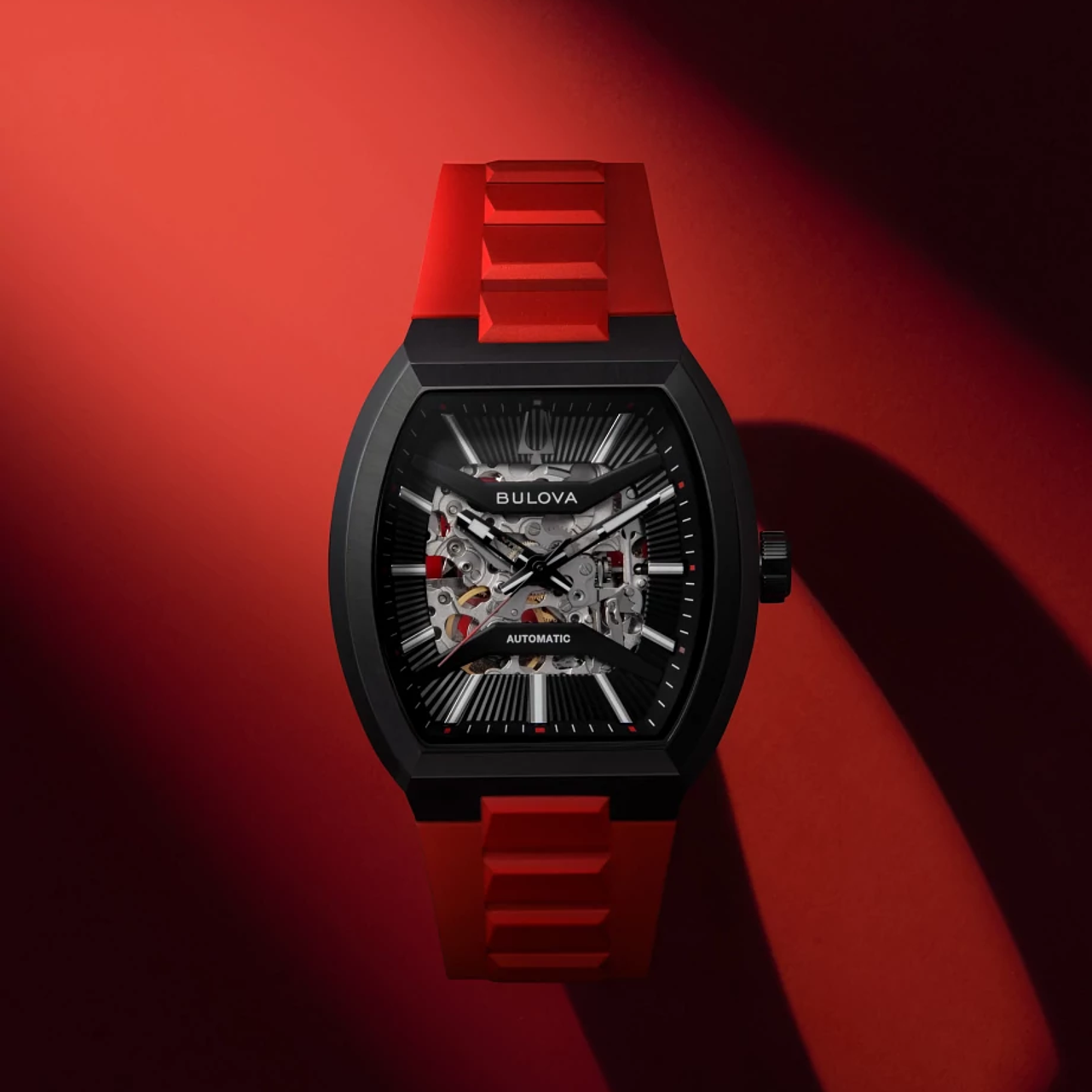 This Bulova men’s watch from the Maquina collection offers a daringly avant-garde design. The watch features a 40mm black-tone stainless steel tonneau case with a curved sapphire crystal and a bold red HNBR rubber strap.