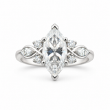 Silver ring with a marquise moissanite center, leaf-shaped side accents and four round accent stones.