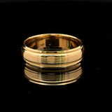 Brushed yellow gold men’s wedding band with polished rails and milgrain edges available  at Solomon Jeweler Kansas.