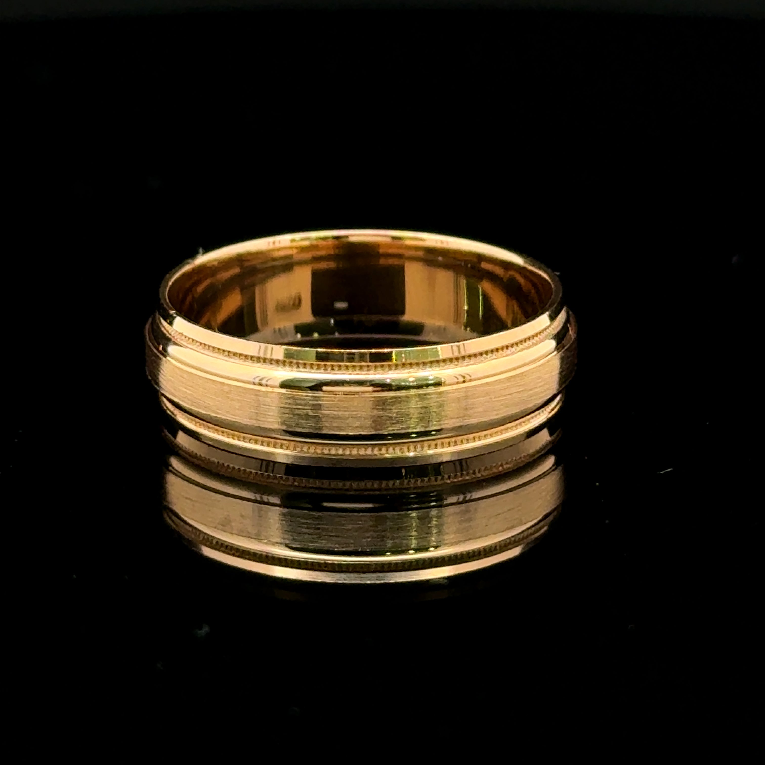 Brushed yellow gold men’s wedding band with polished rails and milgrain edges available  at Solomon Jeweler Kansas.
