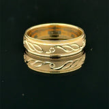 Yellow gold men’s wedding band with polished infinity pattern and milgrain edge available at Solomon Jeweler kansas.