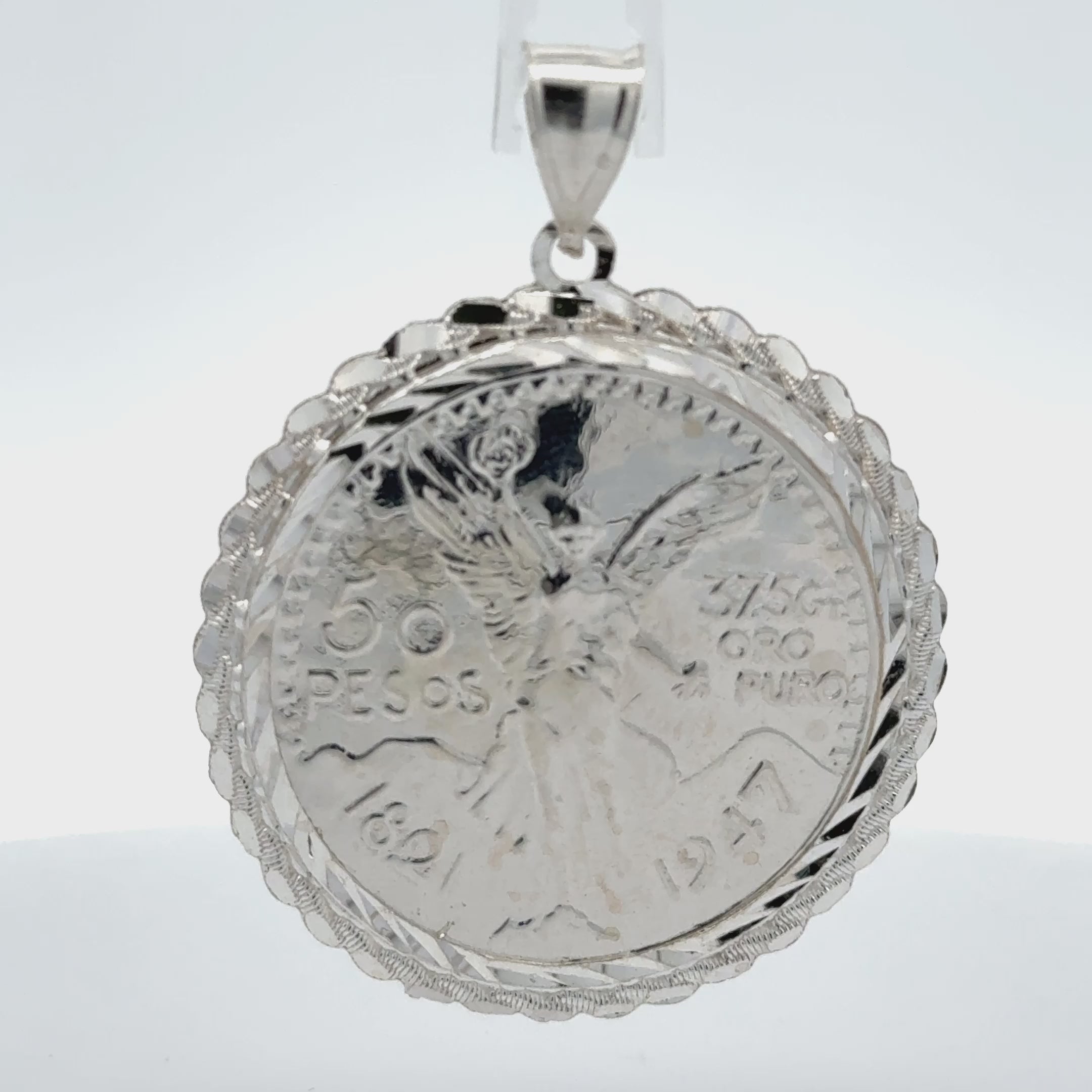 Sterling silver 50 peso centenario coin pendant.