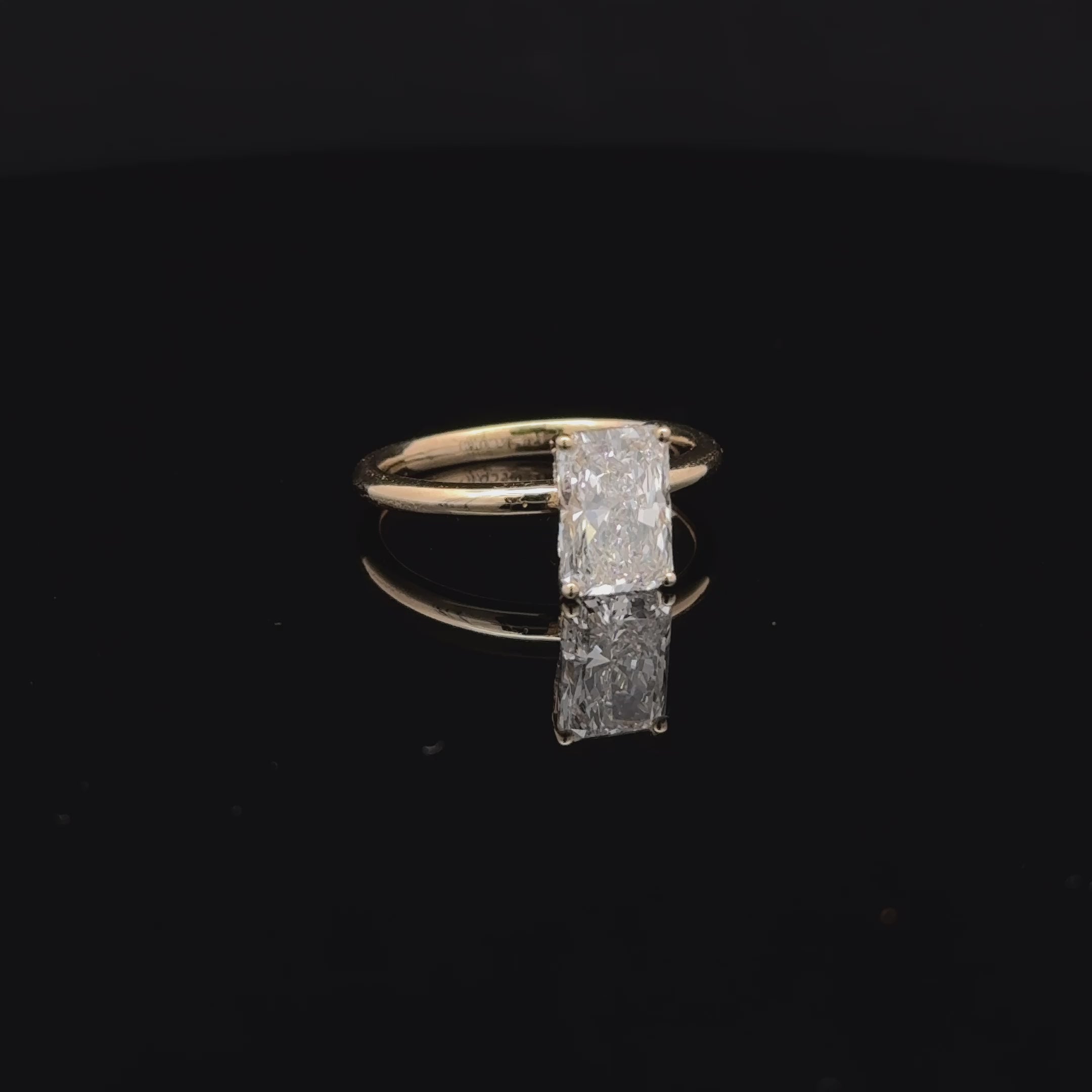 Radiant engagement ring with hidden halo available at Solomon Jewelers.