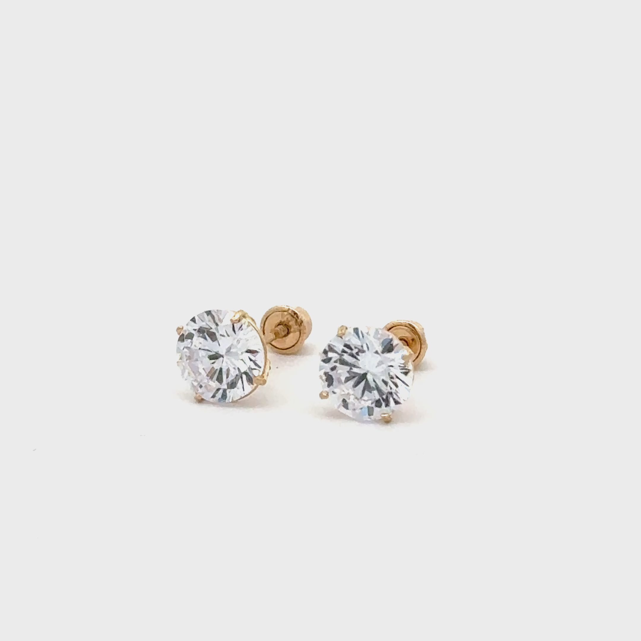 14 karat gold round stud earrings with screw backs.
