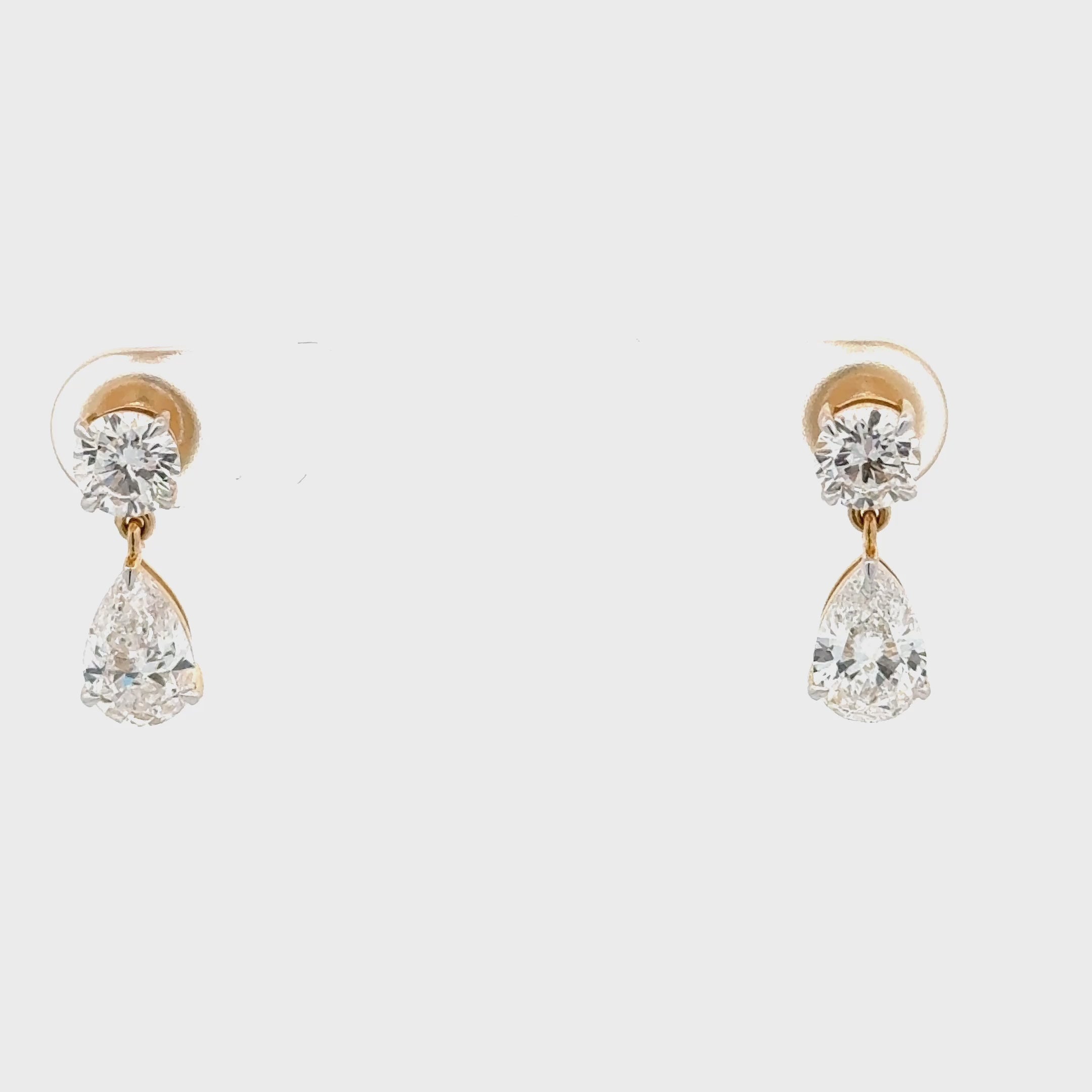 video of 14K lab diamond drop earrings with round and pear-cut diamonds