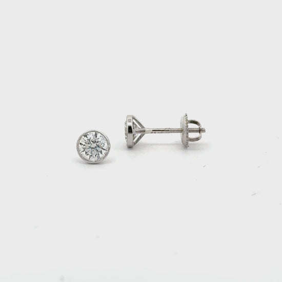 Video of 14K yellow gold bezel-set lab diamond stud earrings with screw backs – Solomon Jeweler.