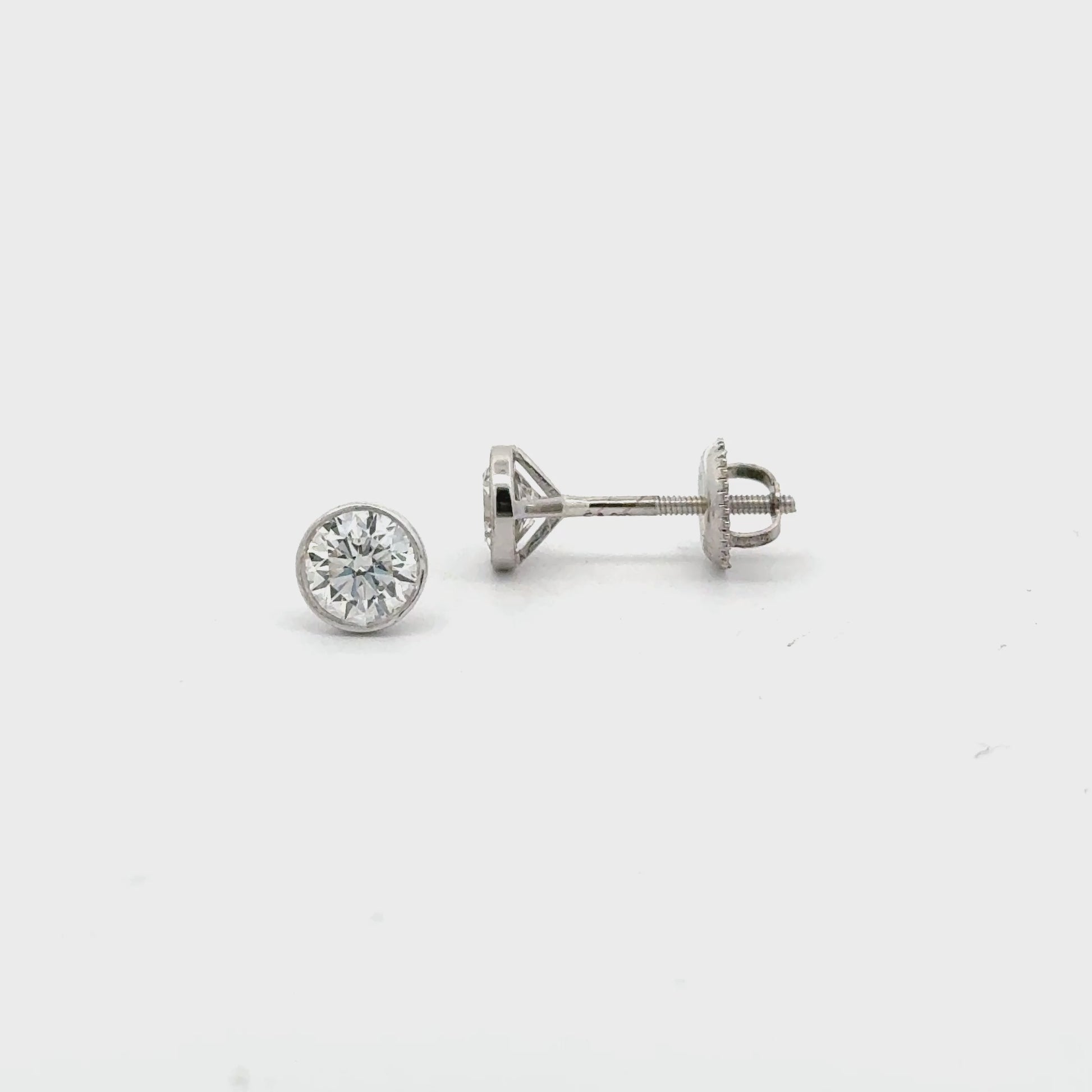 Video of 14K yellow gold bezel-set lab diamond stud earrings with screw backs – Solomon Jeweler.