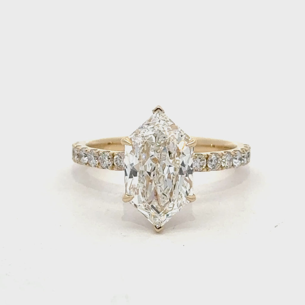 14K yellow gold ring with a Dutch marquise-cut lab-grown diamond, six-prong setting, hidden halo, and shared-prong diamond band on white.