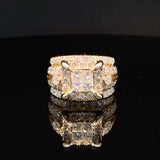 Solomon Jewelers 4 1/6 CT. T.W. princess-cut lab diamond engagement ring in 14k gold with round diamond accents.