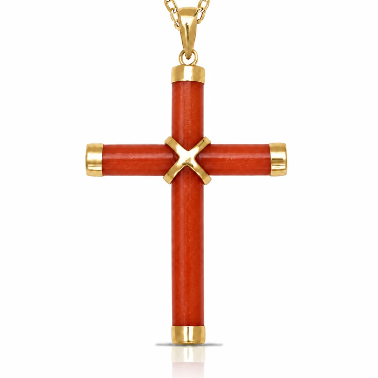 A gold cross pendant with a textured red-orange inlay, featuring a gold 'X' at the center and gold caps at the ends of the cross and chain, shown on a white background.