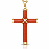 A gold cross pendant with a textured red-orange inlay, featuring a gold 'X' at the center and gold caps at the ends of the cross and chain, shown on a white background.
