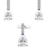 Silver and moissanite pear drop earrings and pendant necklace set by Solomon Jewelers, featuring elegant matching jewelry.