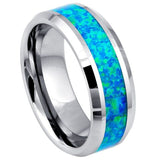 Silver ring with blue opal inlay on a white background