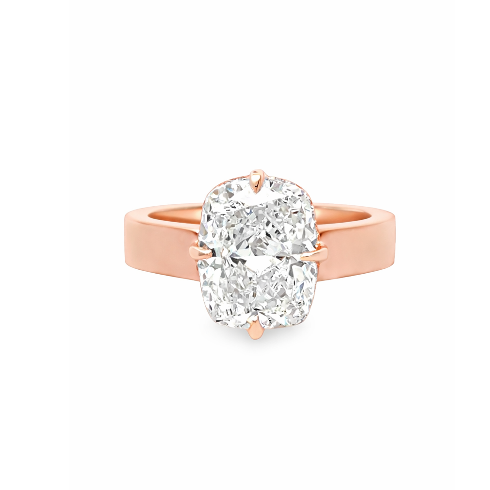 14K rose gold cushion cut solitaire diamond ring with hidden halo on a cigar band.